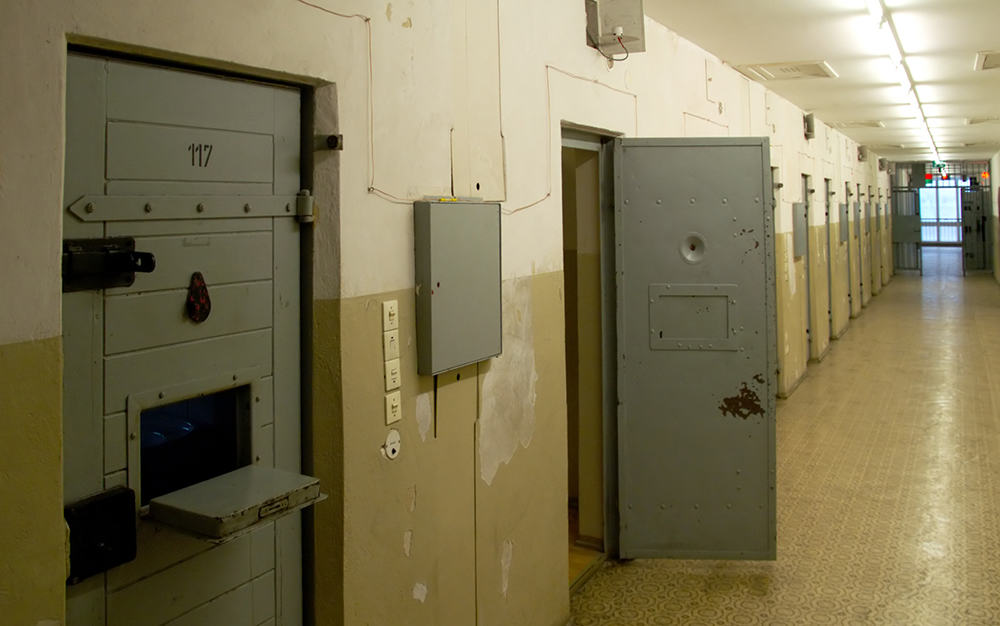 rows of cells in a jail hallway